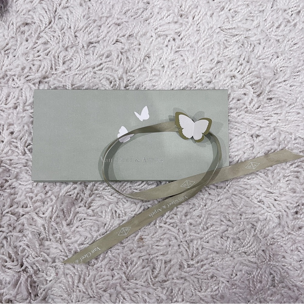 Van Cleef receipt holder and Ribbon with butterfly on top